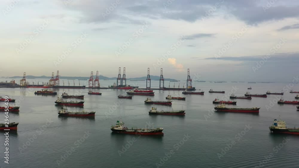 Aerial top view of the ship carrying the lpg and oil tanker in the sea port with vessel logistics. For energy export and import business for transportation trade. footage video 4k B-roll scene. Aerial top view of the ship carrying the lpg and oil tanker in the sea port with vessel logistics. For energy export and import business for transportation trade. footage video 4k B-roll scene.