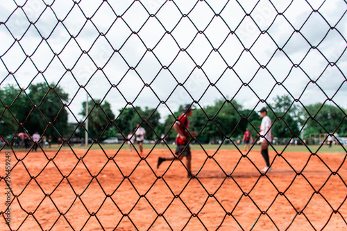 Photos Picture of the softball field being played  That was taken through the net