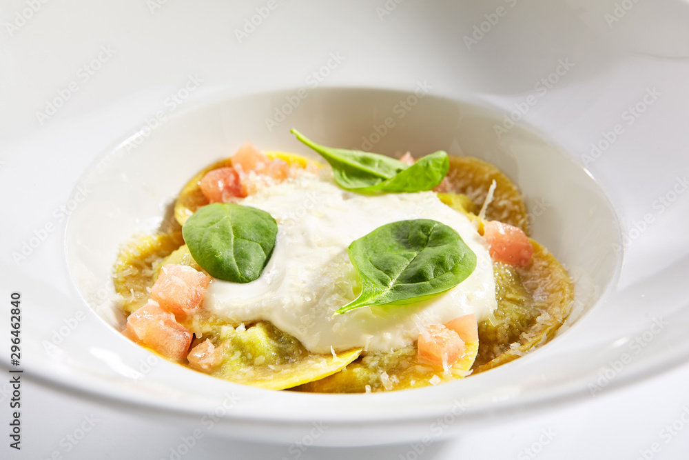 Ravioli with spinach, concasse and cheese espuma Ravioli with spinach, concasse and cheese espuma