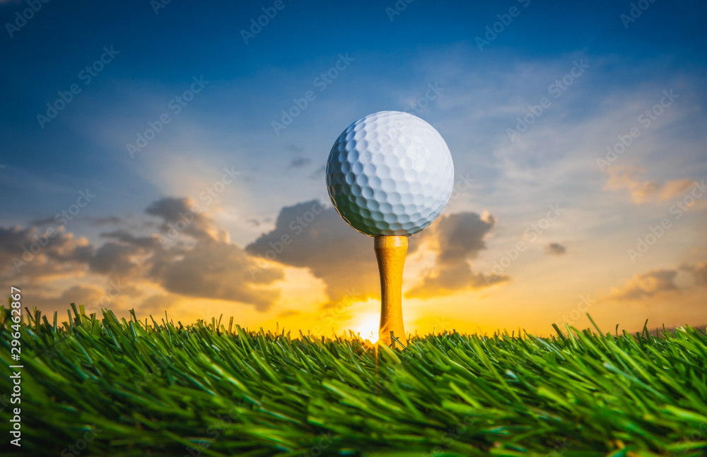 golf ball on tee pegs ready to play in the golf course at sunset with clouds in the evening day background, sport outdoor golf ball on tee pegs ready to play in the golf course at sunset with clouds in the evening day background, sport outdoor
