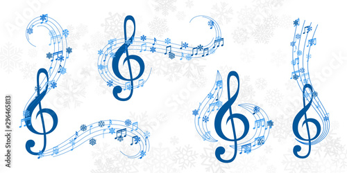 Christmas design element form  flying lines, music notes and snowflakes. Winter holiday decoration on the light background from snow.