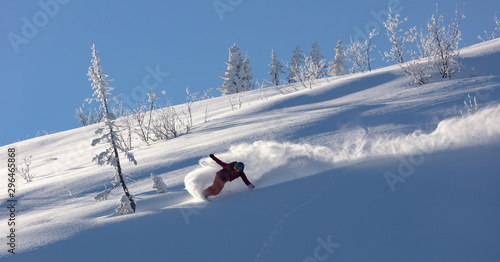 Billede på lærred Extreme snowboarder has fun riding fresh powder snow off piste in white mountains