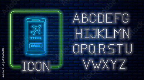 Glowing neon Smartphone with electronic boarding pass airline ticket icon isolated on brick wall background. Passenger plane mobile ticket for web and app. Neon light alphabet. Vector Illustration