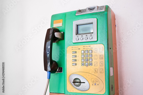 Fotografie Close-up shot of coin-operated public payphone
