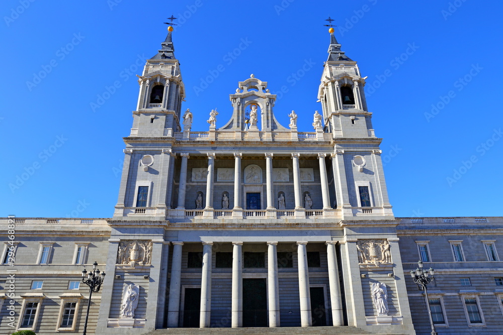 Almudena Cathedral (Catedral de Santa Maria la Real de la Almudenaon) on the other side of the Royal Palace in Madrid, Spain.