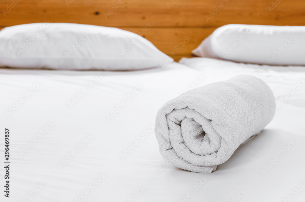white towel on bed white towel on bed