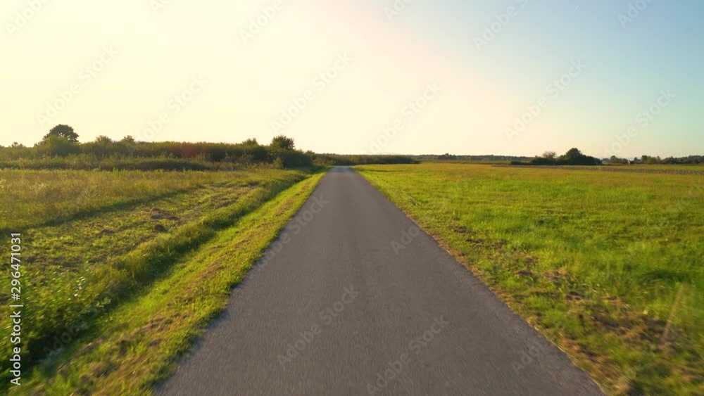 Point of view riding bicycle in the countryside during golden hour, Croatia. Point of view riding bicycle in the countryside during golden hour, Croatia.
