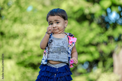 cute indian baby girl  playing in the park © Niks Ads