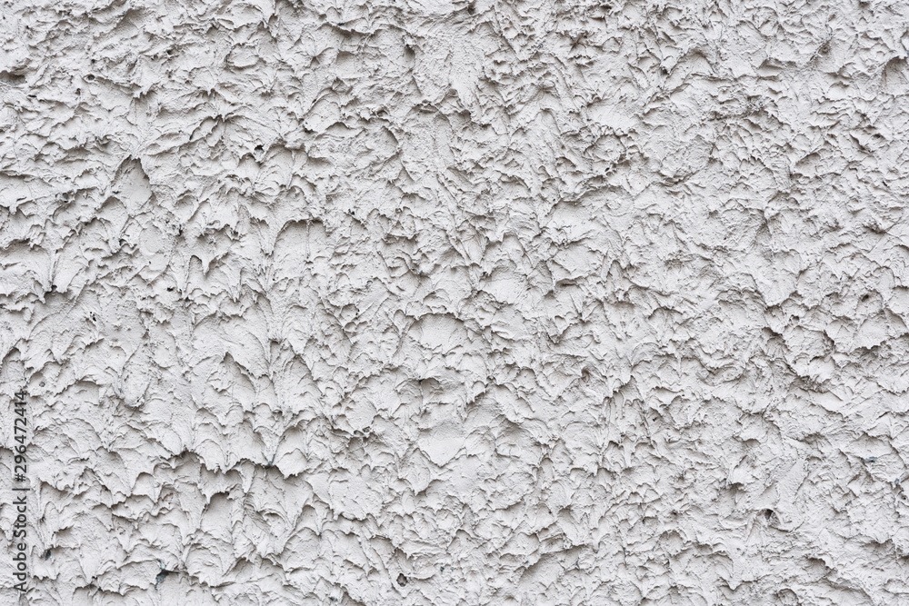 Rough white relief stucco wall texture background. blank for designers