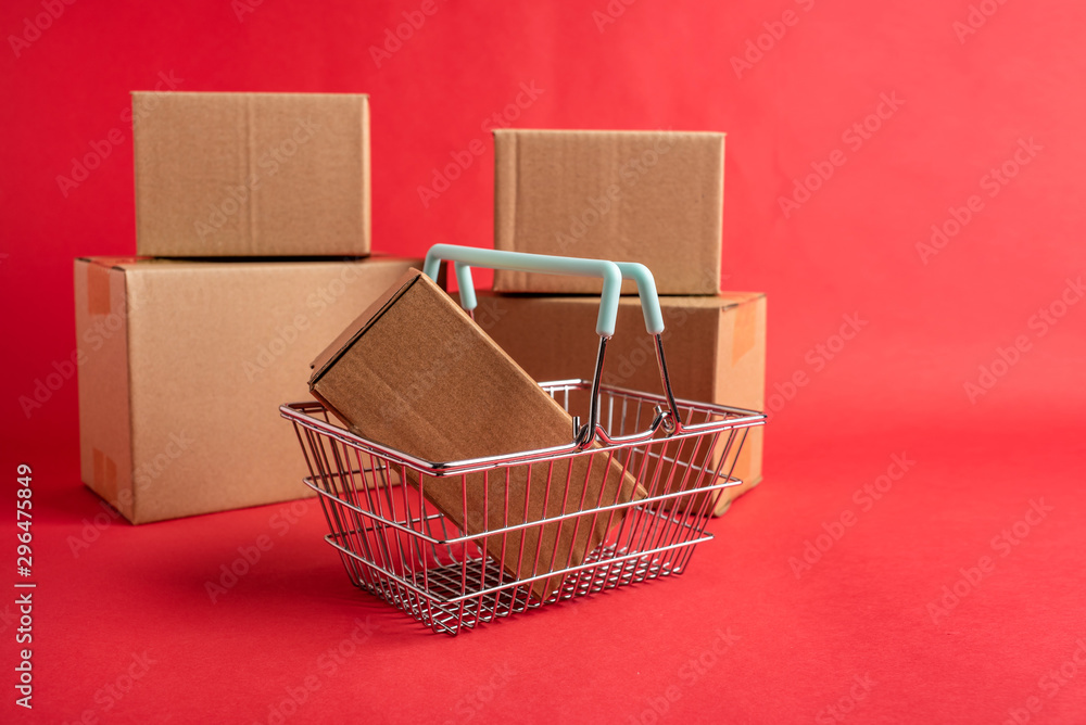 Shopping basket and kraft paper shopping bag consumption online shopping concept illustration on red background Shopping basket and kraft paper shopping bag consumption online shopping concept illustration on red background