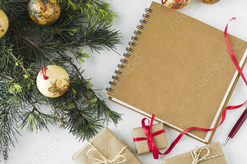 Notepad with baubles and green branches