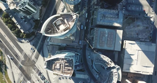 Down-looking aerial view of a sunny developped global futuristic city, with skyscrapers towers and big avenues, circulation and cars, in Doha, Qatar photo