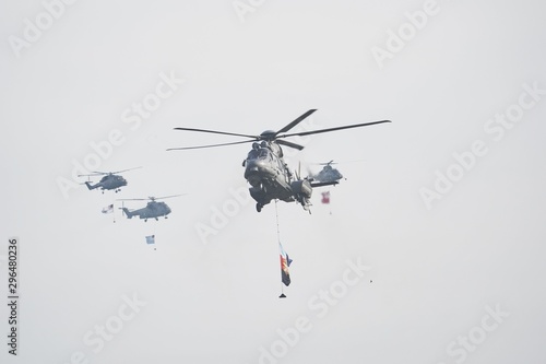 Fototapeta Naklejka Na Ścianę i Meble -  A Group of flying helicopters