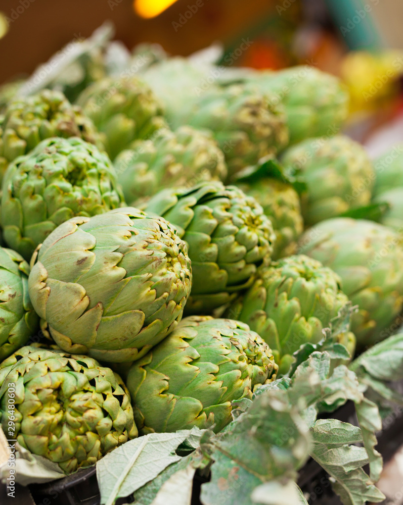 Fototapeta premium Fresh artichokes on market counter
