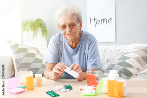 Elderly woman with medicine...