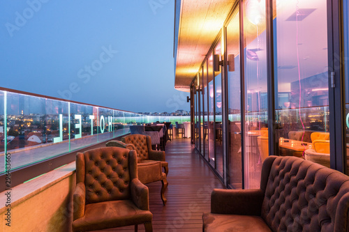 Interior of a rooftop hotel bar restaurant terrace photo