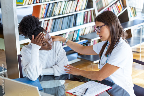 Patient receiving bad news, She is desperate and crying, Doctor support and comforting her patient with sympathy. Don't worry, this medical test is not so bad