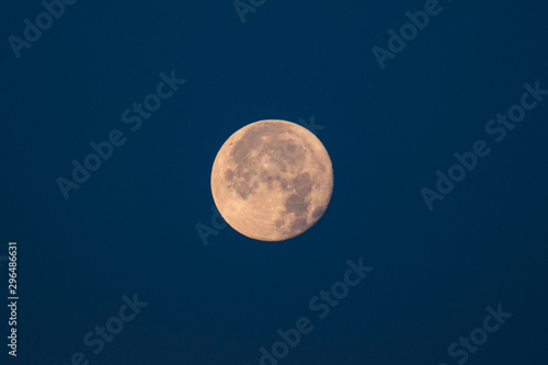 Full moon against the dark sky.