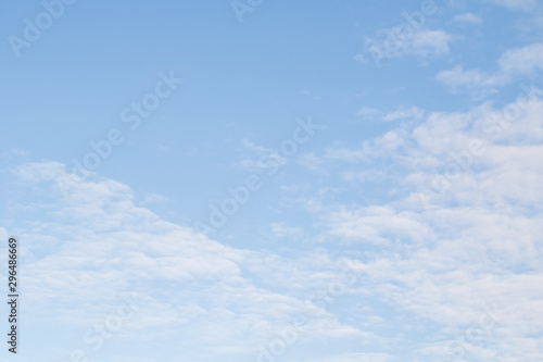 Blue sky, clear sunny day, white haze of clouds.