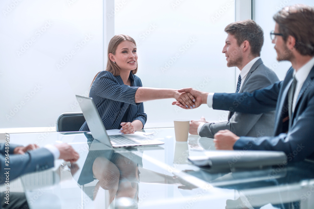 Business people shaking hands in board room Business people shaking hands in board room