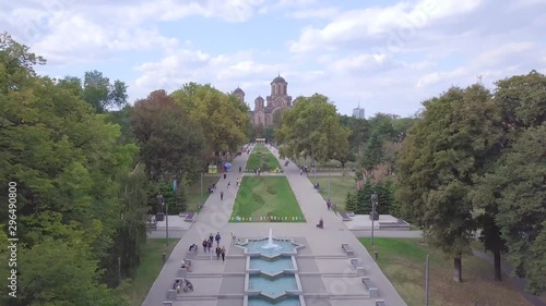Stunning long 4k aerial flight shot over Tasmajdan Park and St Marko church in Belgrade