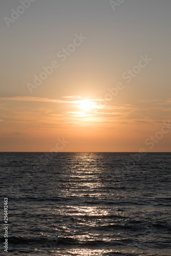 Dark sea surface with waves and sun reflection © hdesert