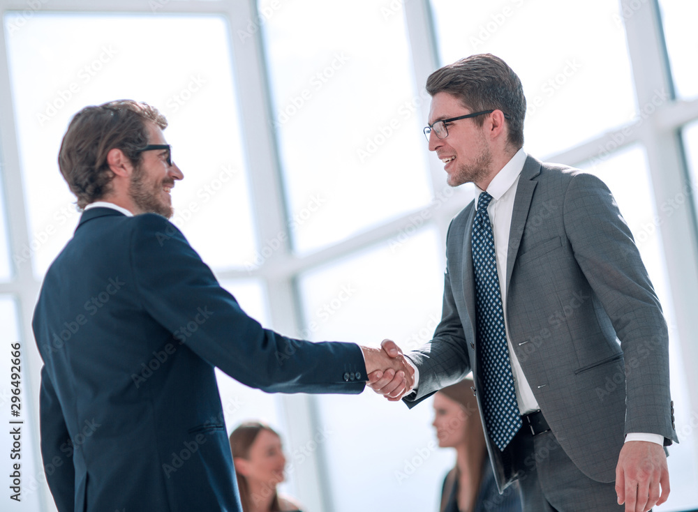 business colleagues shaking hands with each other. business colleagues shaking hands with each other.