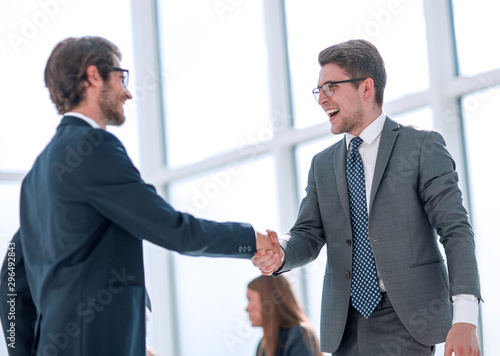 business colleagues shaking hands with each other.