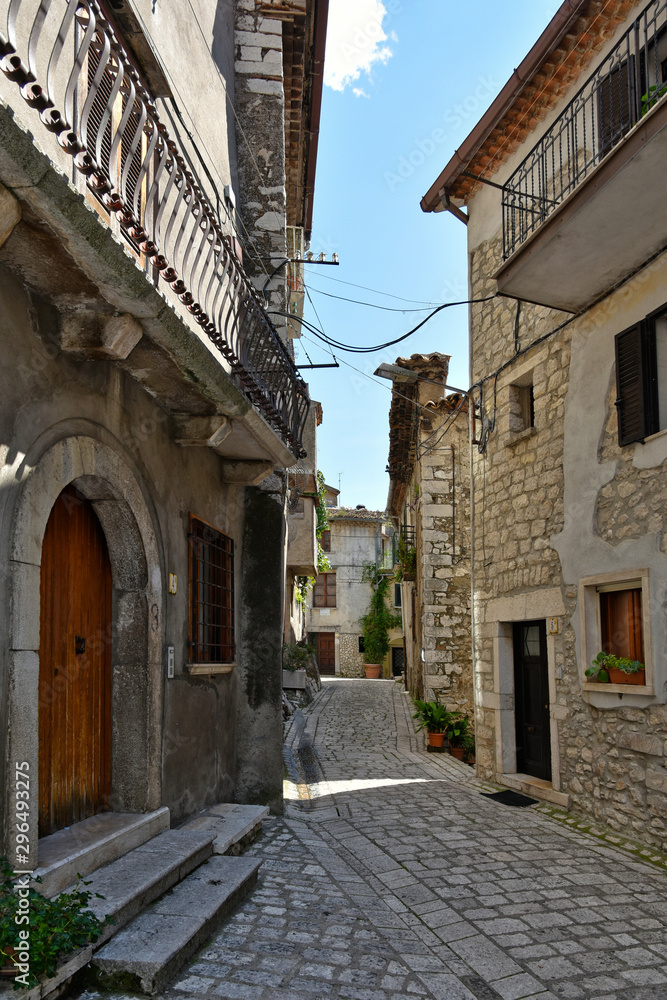 Province of Benevento, Italy, 09/15/2018. A road among the old houses of a mountain village.