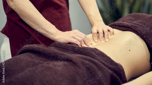 Treatment massage for weight loss in spa salon. Massage back for woman. Spa massage for correction figure. © yavdat