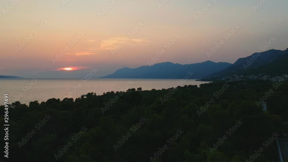 An aerial clip from drone to the trees and sunset over sea in Croatia An aerial clip from drone to the trees and sunset over sea in Croatia