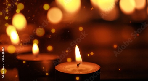 Close up view of the candles cutting through the darkness. © BillionPhotos.com