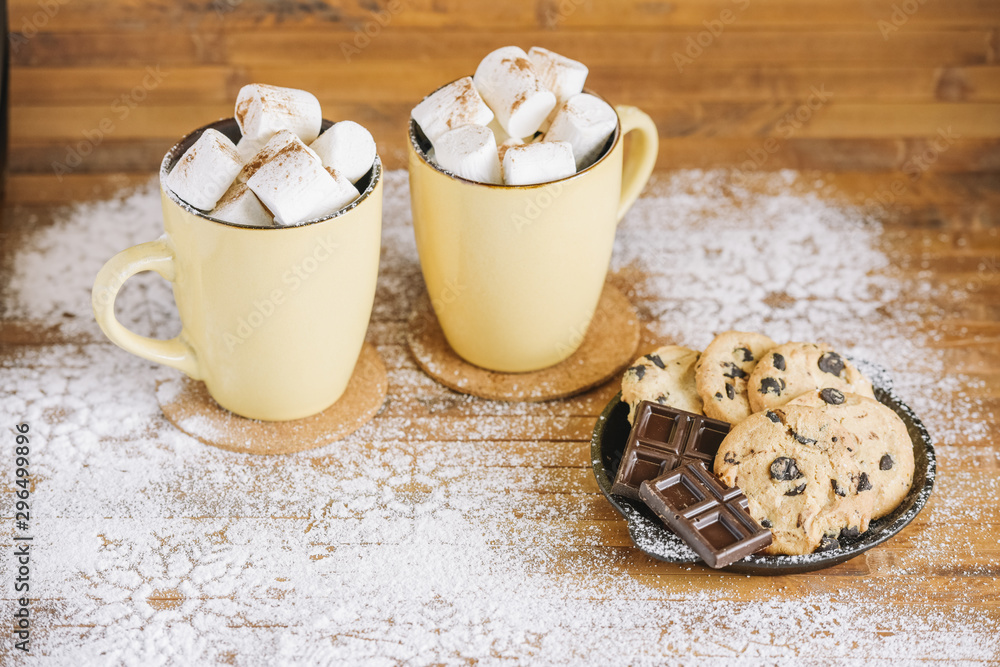 Cocoa cups with sweets on table Cocoa cups with sweets on table