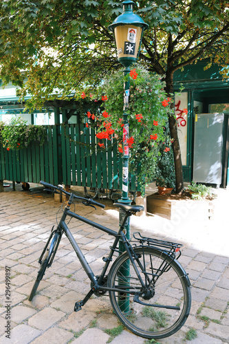 Bicycle standing near the tree in the one of the inner yard near Mariahilfer Strasse photo