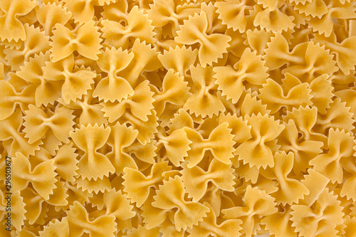 Farfalle - bow shaped pasta background.