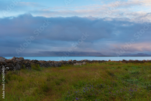 A landscape around sunset of the Atlantic Coast  photographed near the Grotta Island Lighthouse  Reykjavik  Iceland.