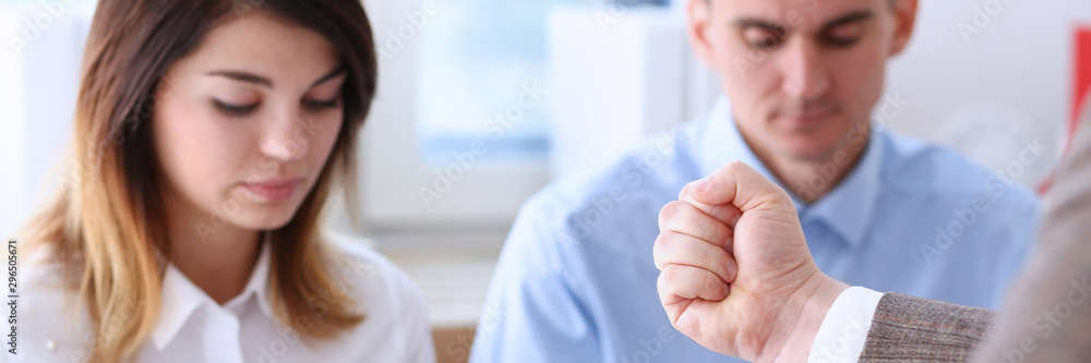 Businessman hand threatens his hired employees threatens staff Businessman hand threatens his hired employees threatens staff