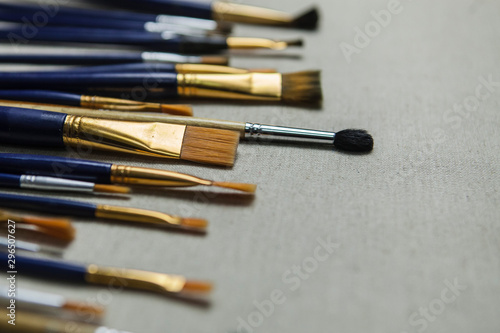 Artist oil Paint Brushes closeup on artistic canvas