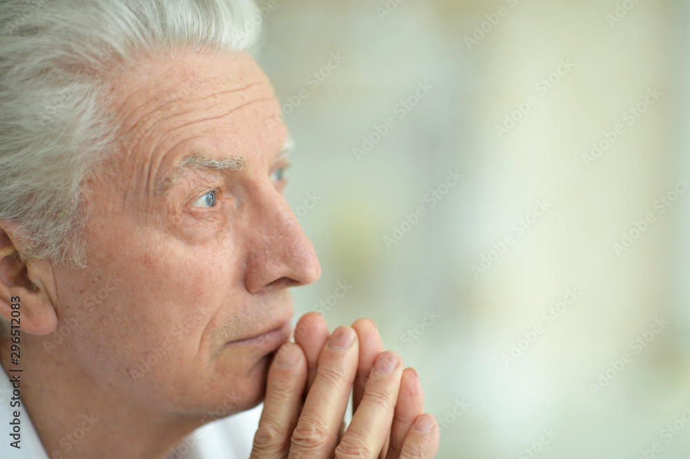 Close up portrait of sad thinking senior man Close up portrait of sad thinking senior man