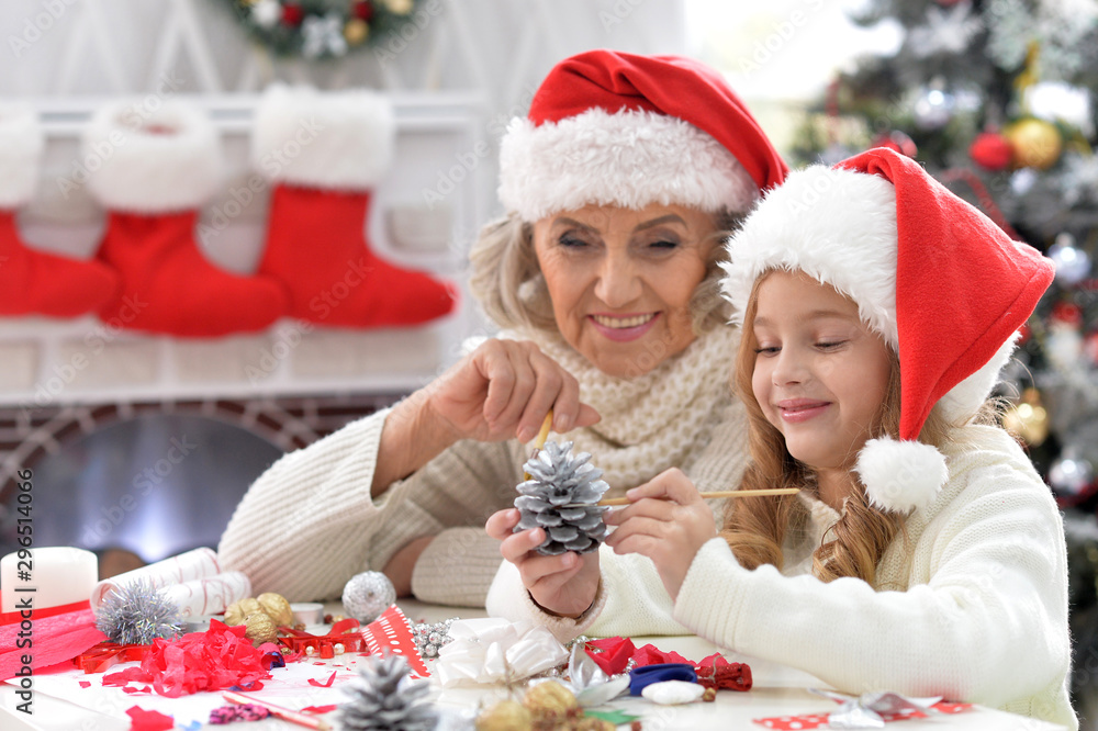 Portrait of grandmother and child preparing for Christmas Portrait of grandmother and child preparing for Christmas