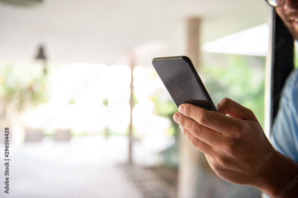 Male hand typing on mobile phone Male hand typing on mobile phone