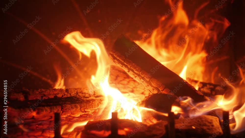 Closeup slow motion video of beautiful fire flames and burning wood in ...
