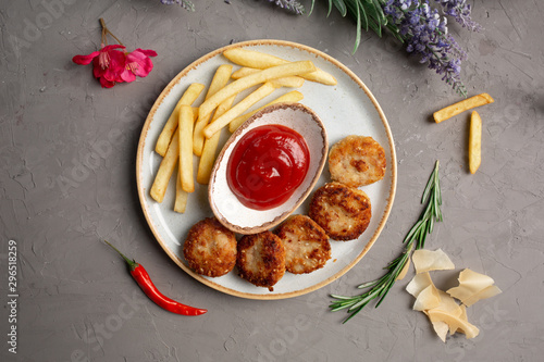 french fries, meat cutlets and ketchup in a white plate © Said Ramazanov