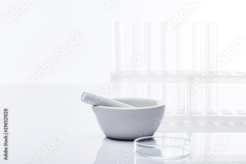 empty glass test tubes and mortar with pestle isolated on white