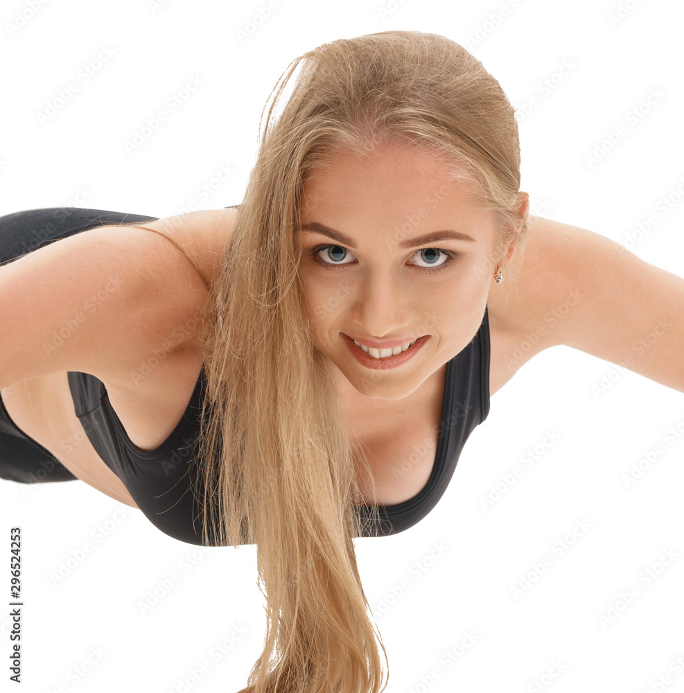 Slim sportswoman in top and leggings in studio Slim sportswoman in top and leggings in studio