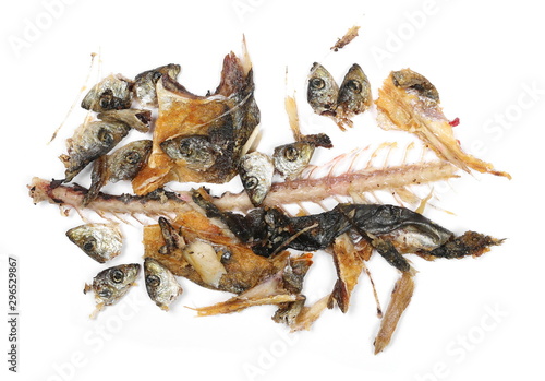 Fried smelt fish remnants, waste isolated on white background, top view