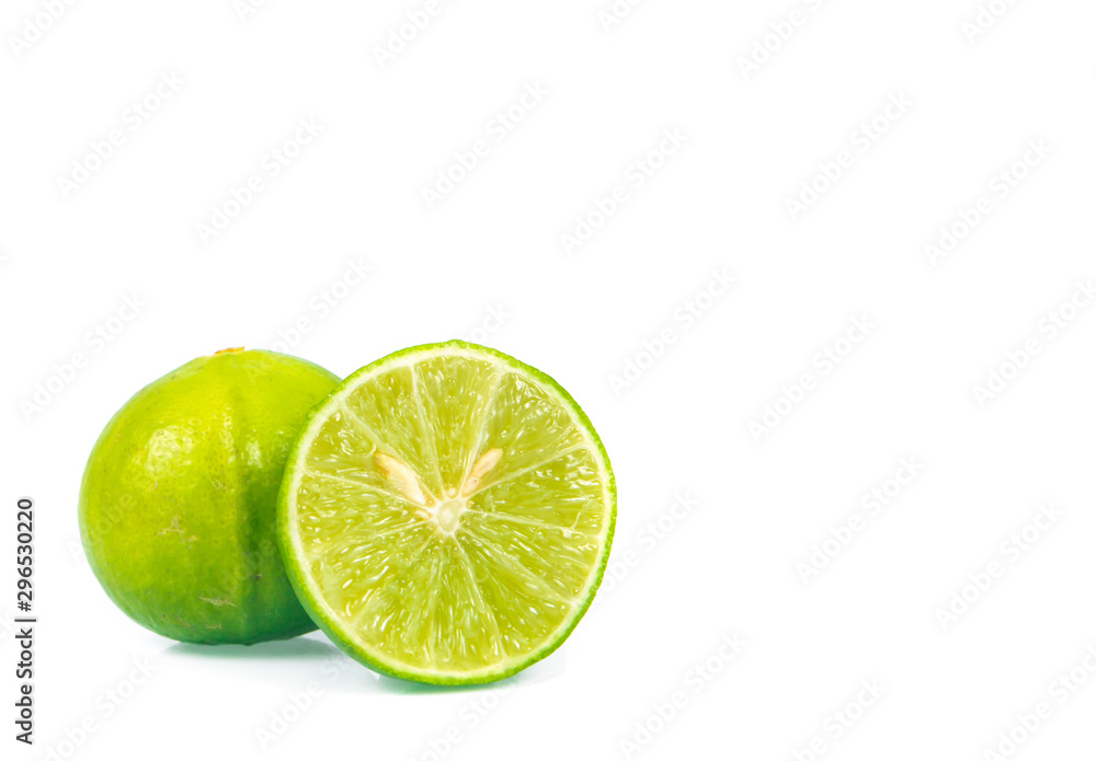 green lemon and slice isolated on white