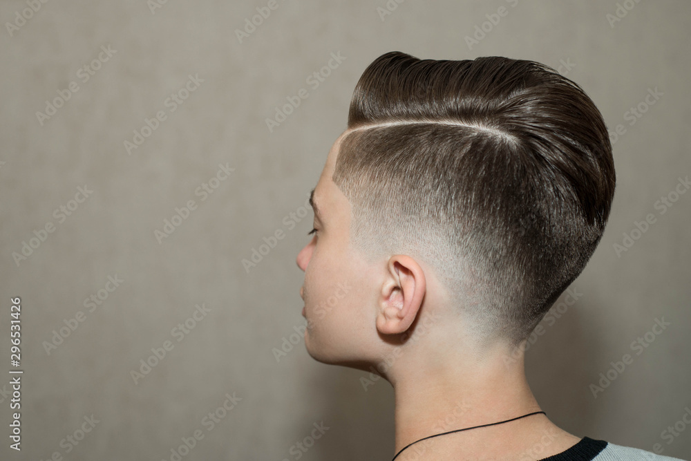 fade haircut with side part
