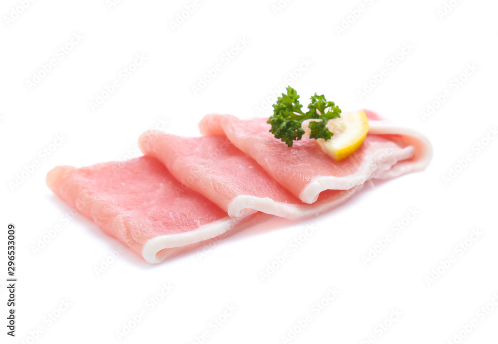 Raw pork meat with parsley herb leaves isolated on white background Raw pork meat with parsley herb leaves isolated on white background