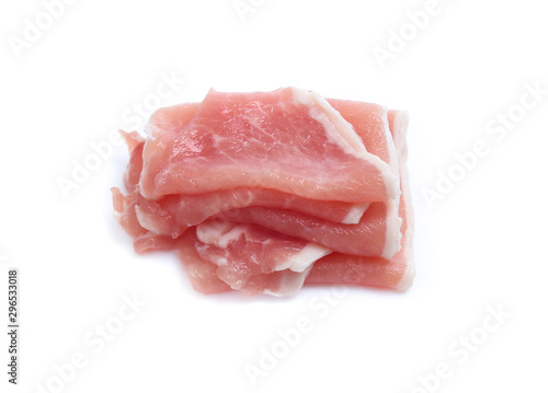Raw pork meat with parsley herb leaves isolated on white background
